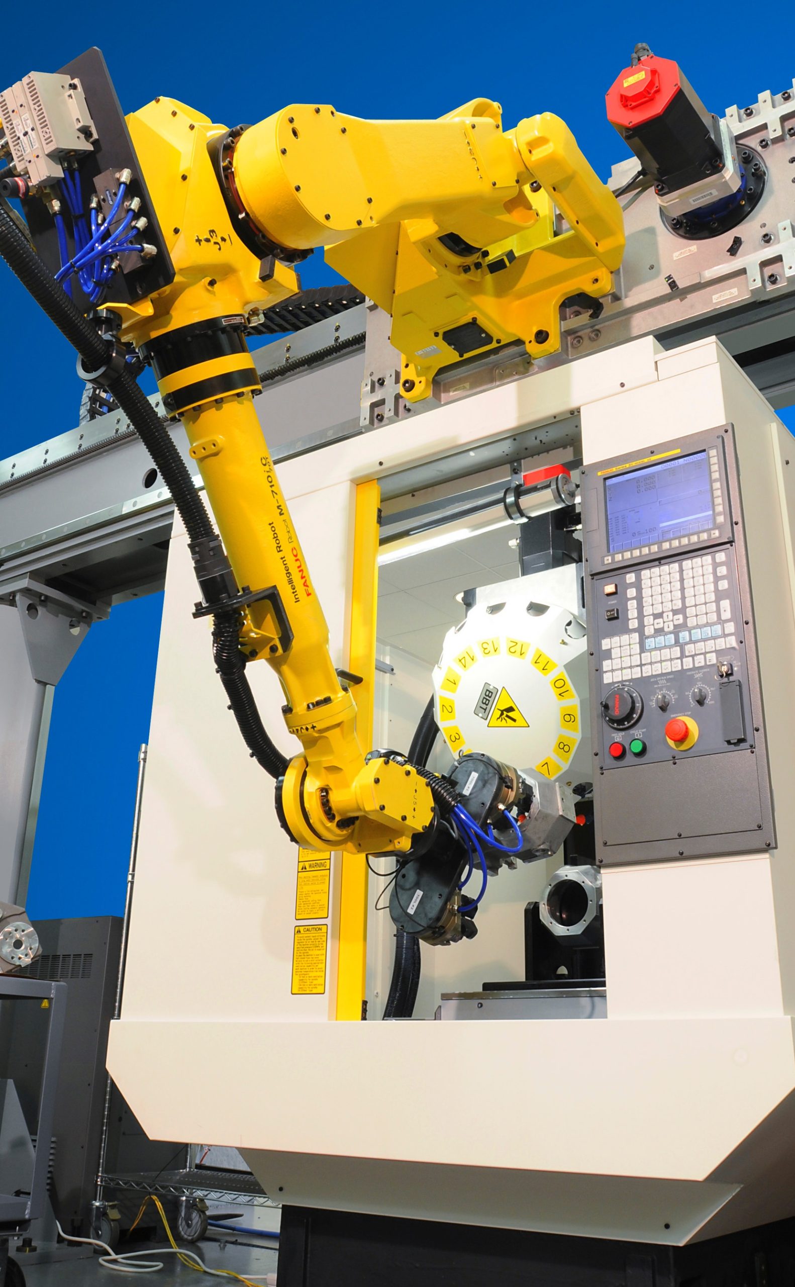 Machine tool tending robots in the automotive industry